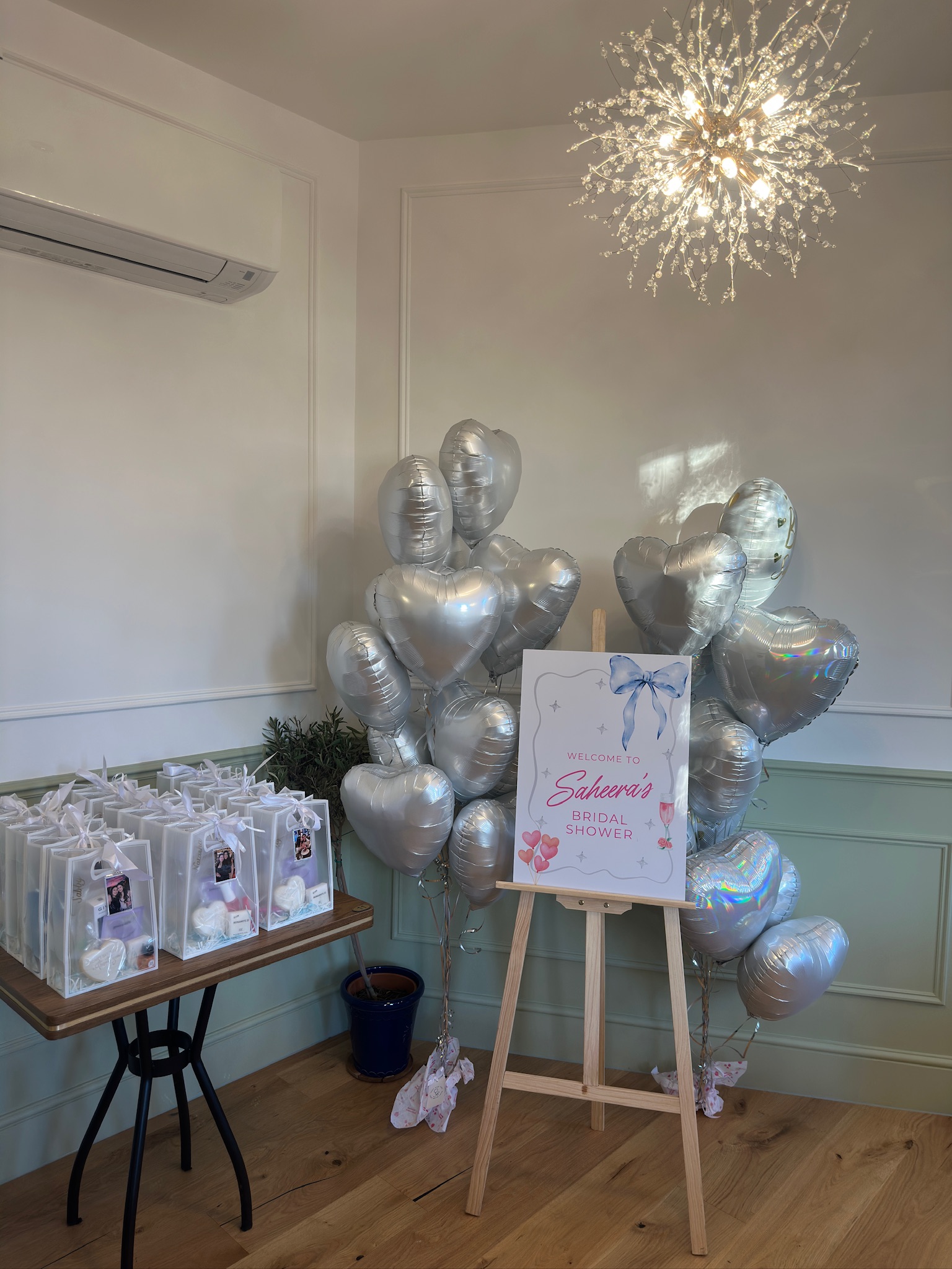 Bridal shower welcome sign and silver balloon styling