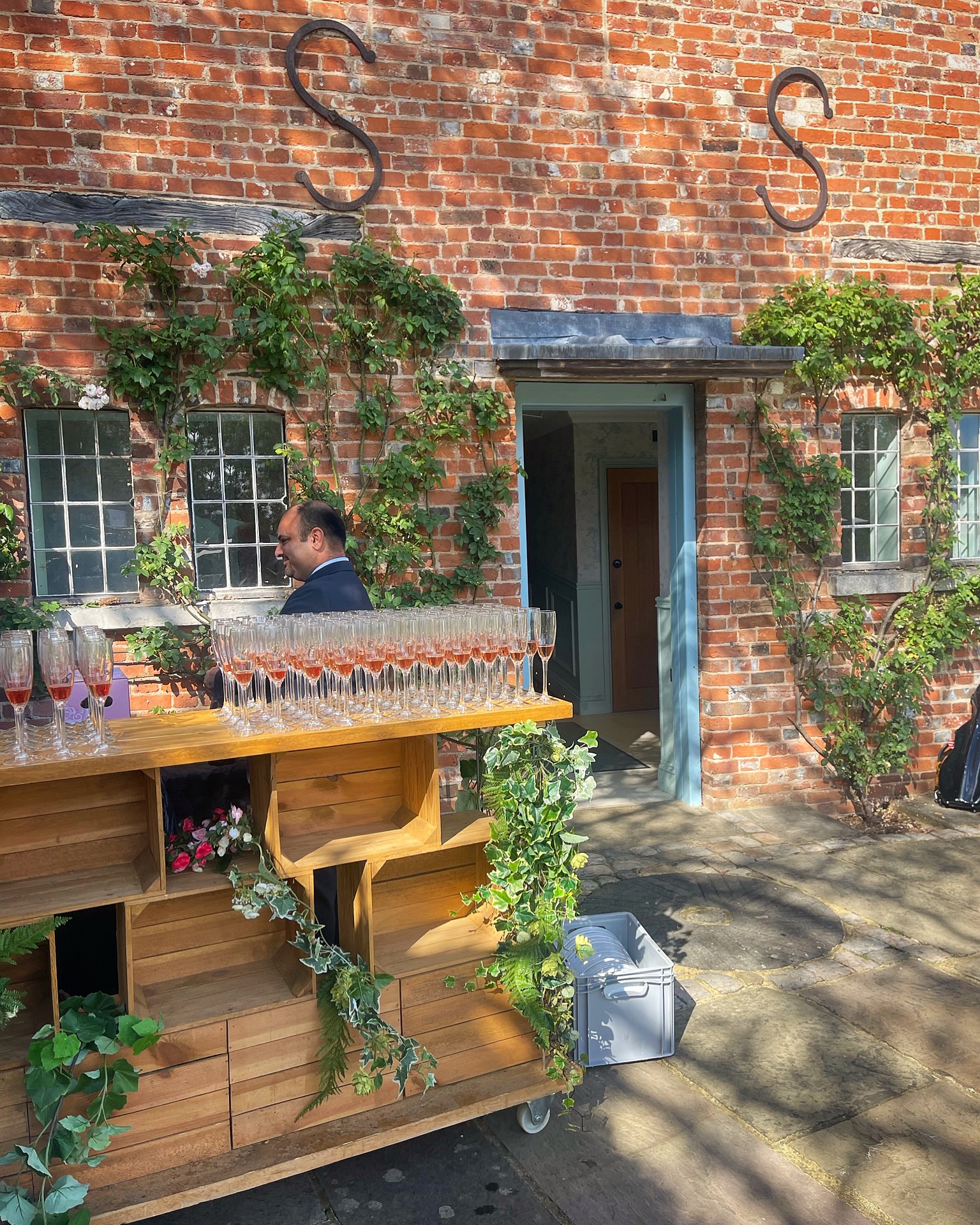 Outdoor wedding bars with bespoke peacock signage