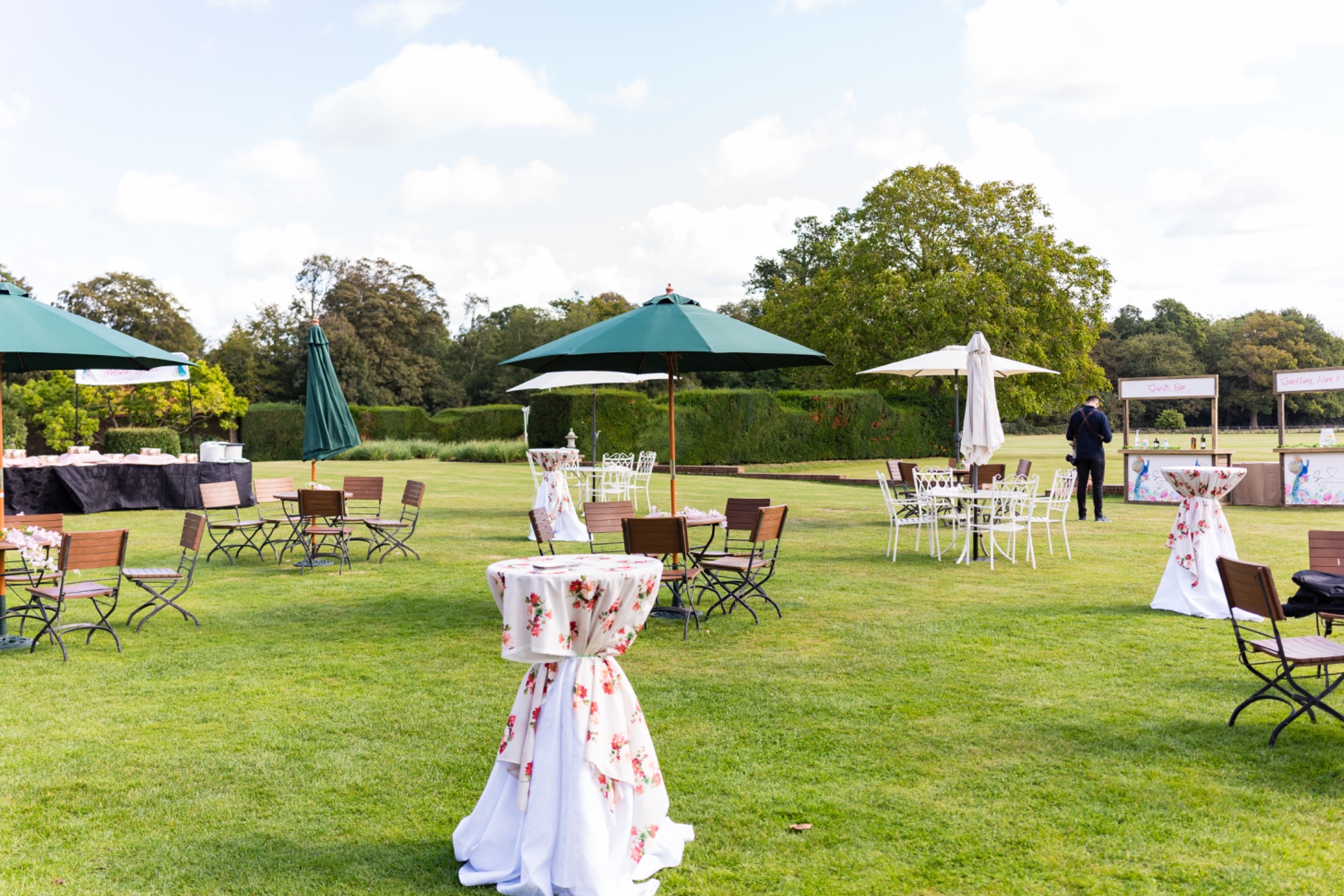 Garden event layout with floral cocktail tables